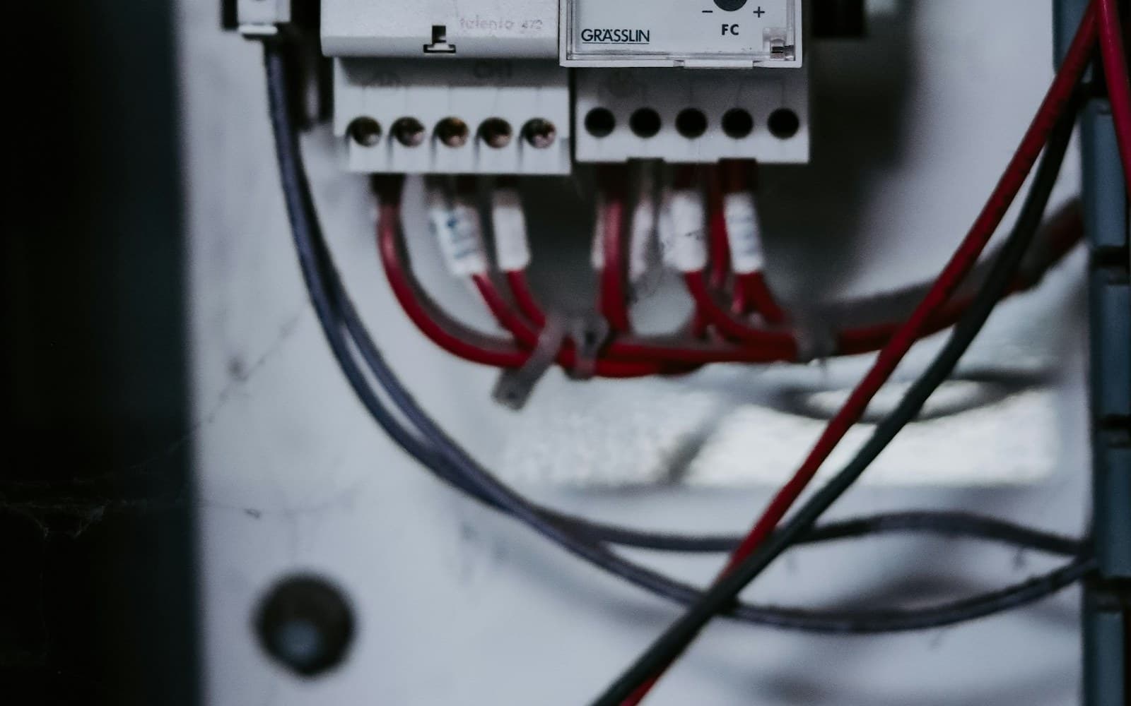 Open industrial control cabinet with relay modules and terminal wiring