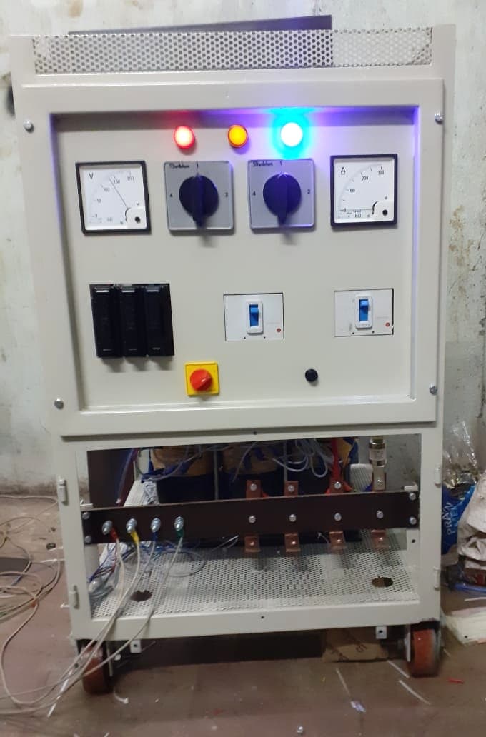 Battery charger cabinet under test at the Equipment Controls Company factory, internal wiring and busbars exposed
