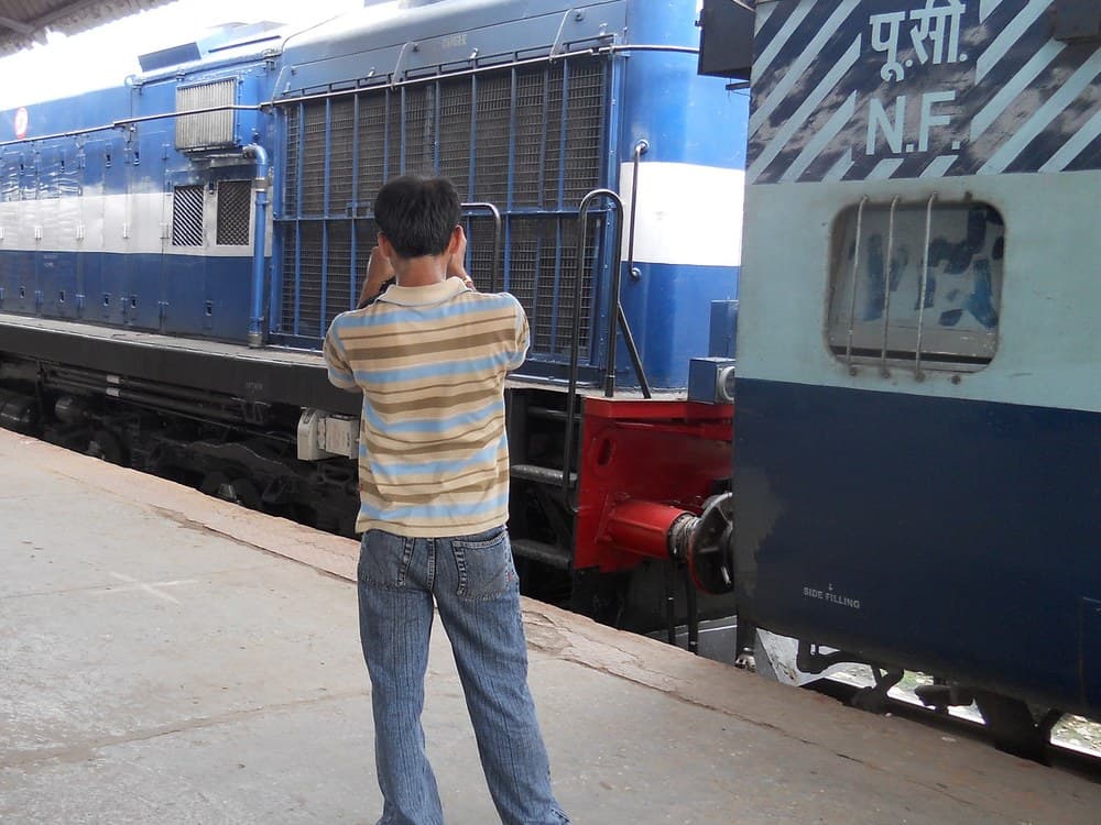 Northeast Frontier Railway (N.F.) locomotive and coach at Guwahati station